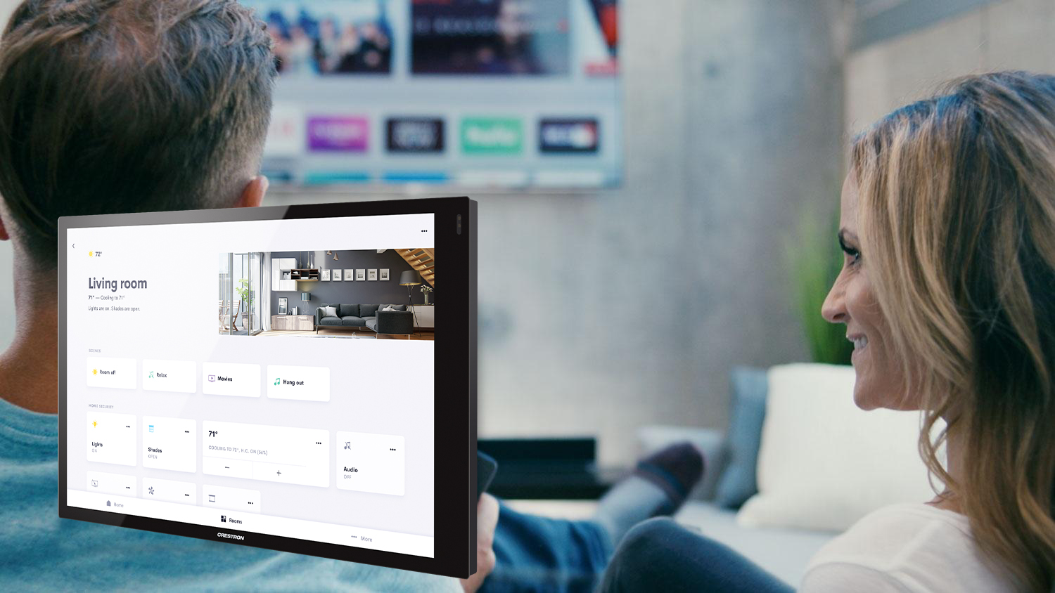 Couple watching tv together with white touch panel product photo